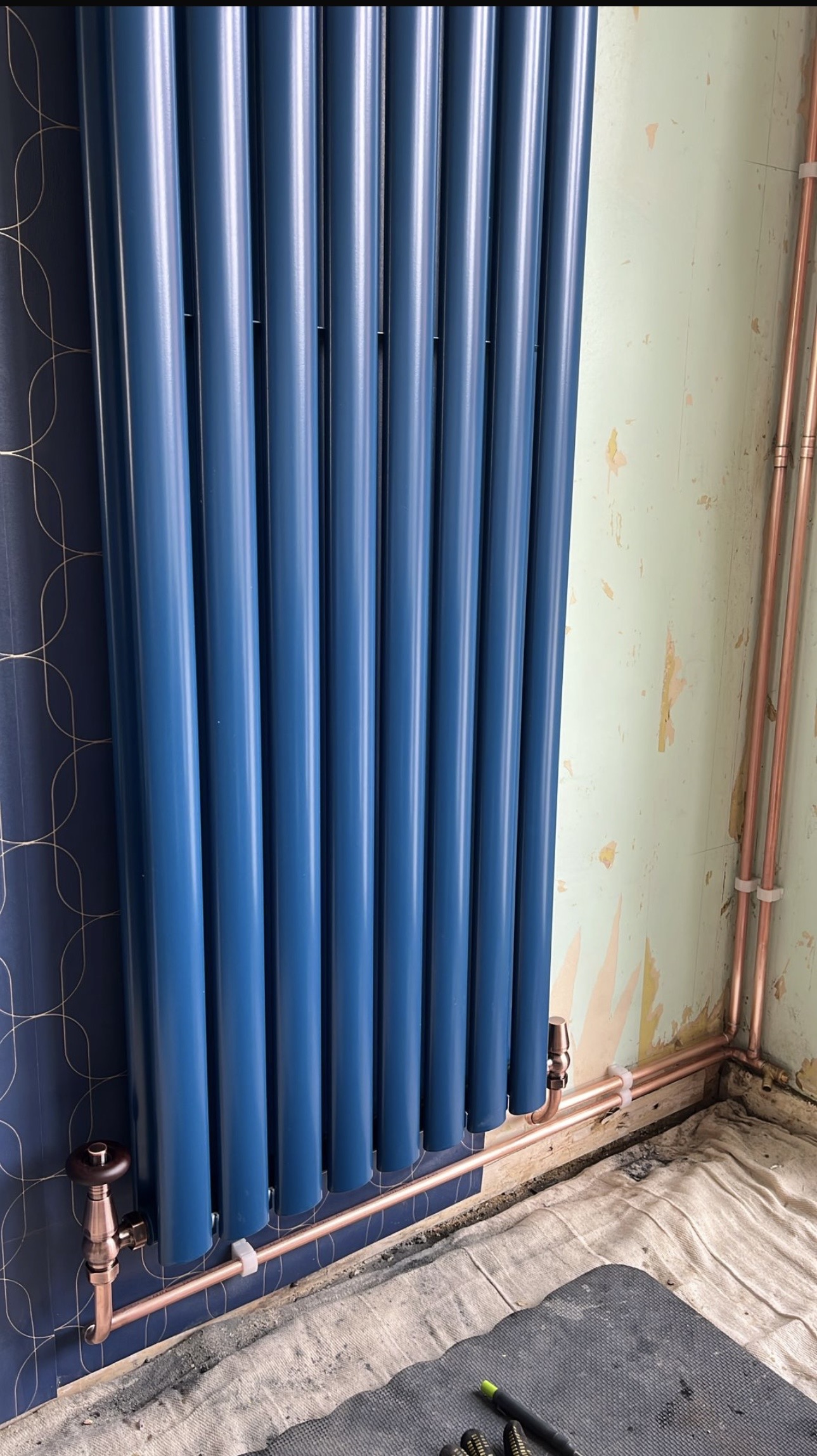 Blue vertical radiator installation